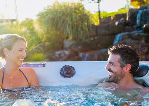 A couple relaxing in a hot tub
