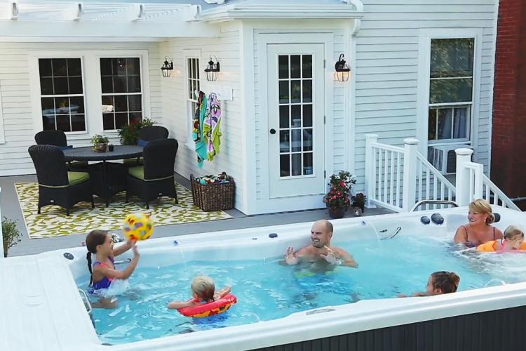 Family playing in Swim Spa